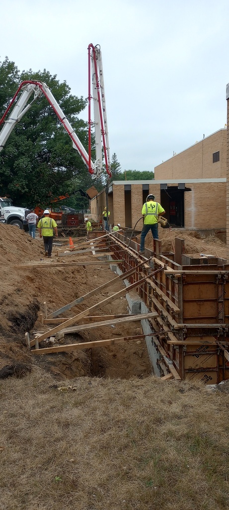 Pouring foundation on the south side of building.