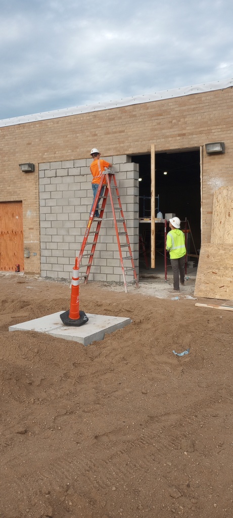 Infilling of the existing Ag Shop door.