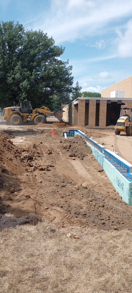 Backfilling the south foundation.