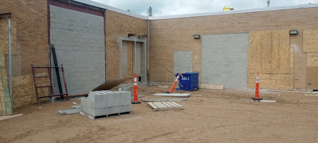 Old shop doors on the north side of the high school have been filled in and new opening have been cut in.