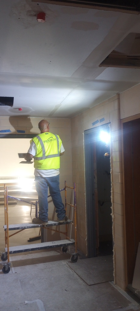 Drywall finishing in the Band / Choir entryway.