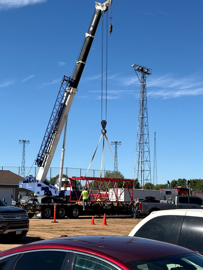 Unloading a portion of the crane boom.