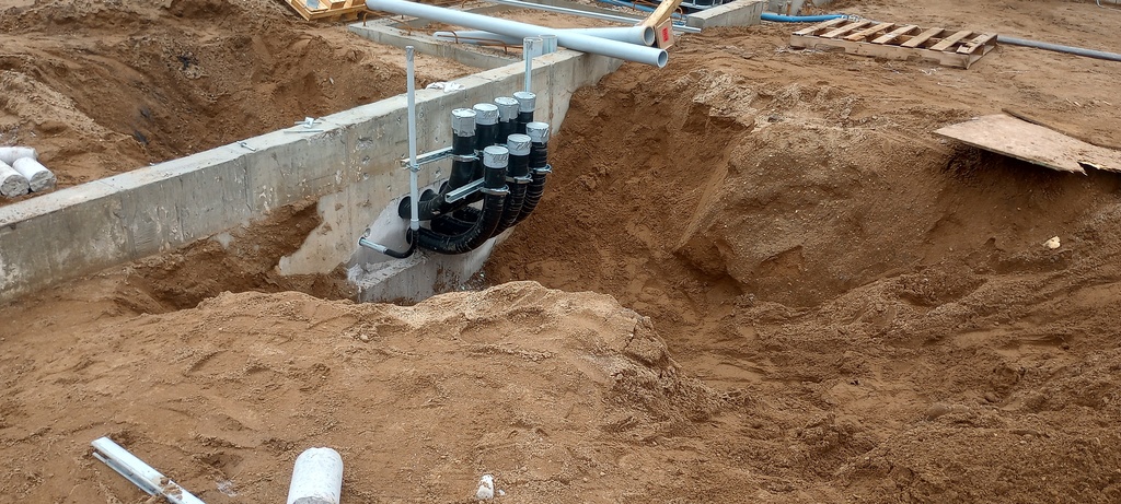 Electrical service conduit roughed in for the building additions.