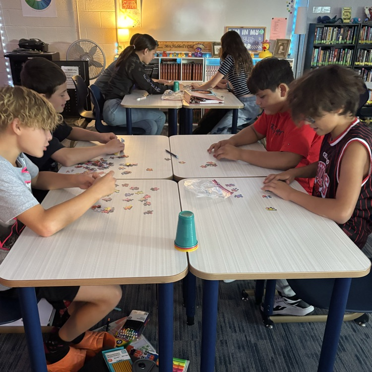 Mrs. Hubbell’s class practiced putting together a puzzle with seeing the picture today. How will this help them write their social contract this week?