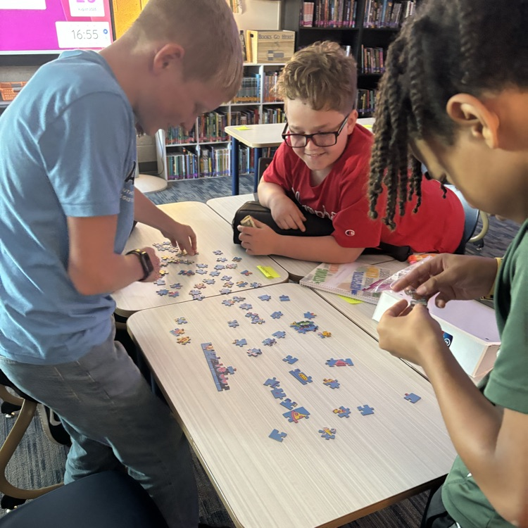 Mrs. Hubbell’s class practiced putting together a puzzle with seeing the picture today. How will this help them write their social contract this week?