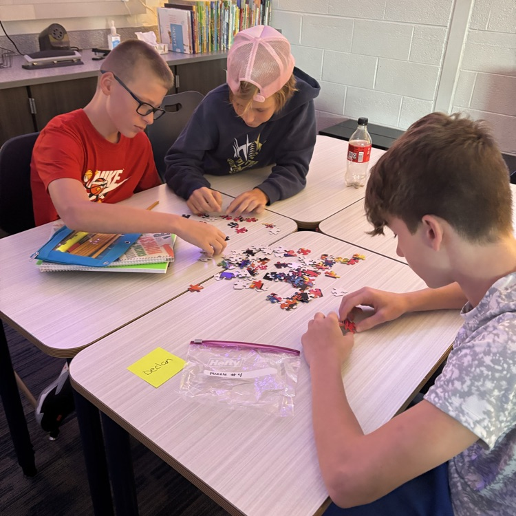 Mrs. Hubbell’s class practiced putting together a puzzle with seeing the picture today. How will this help them write their social contract this week?