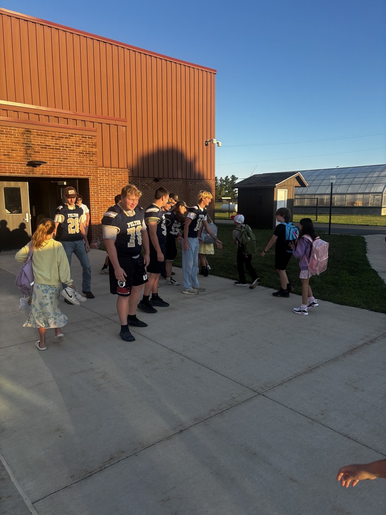 Varsity Football Welcomes Elementary Students