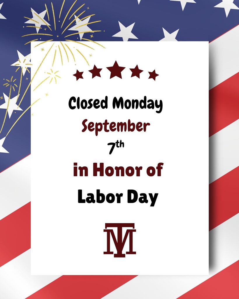 A white sign on an American flag background reads "Closed Monday September 7th in Honor of Labor Day" with a logo.