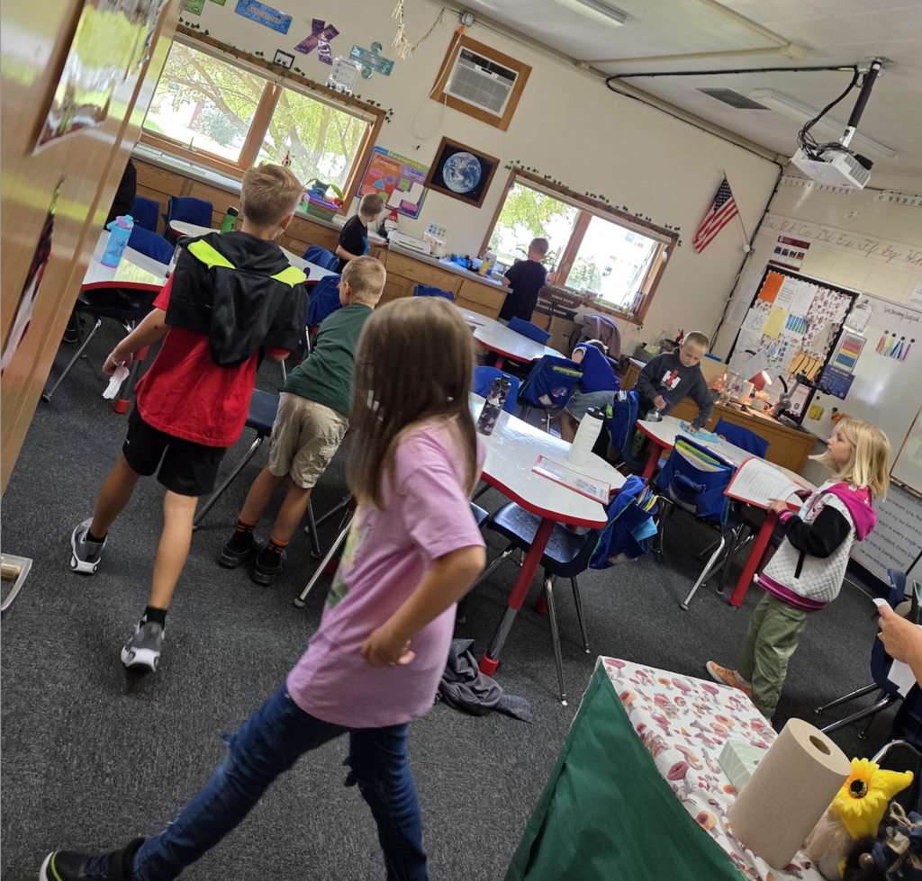 Students cleaning up their classroom