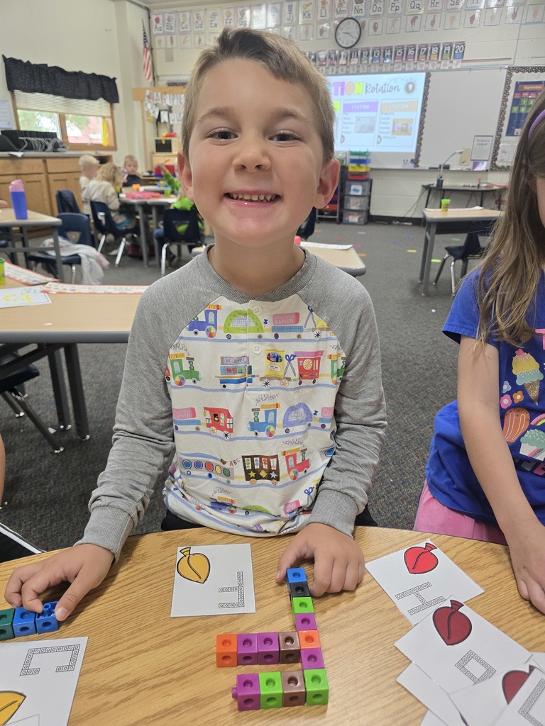 Student with letter F built out of linking blocks