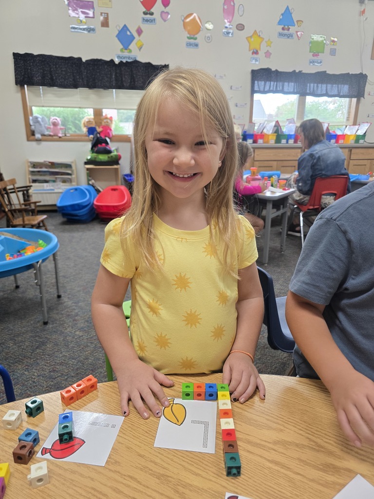 Student with letter L built out of linking blocks
