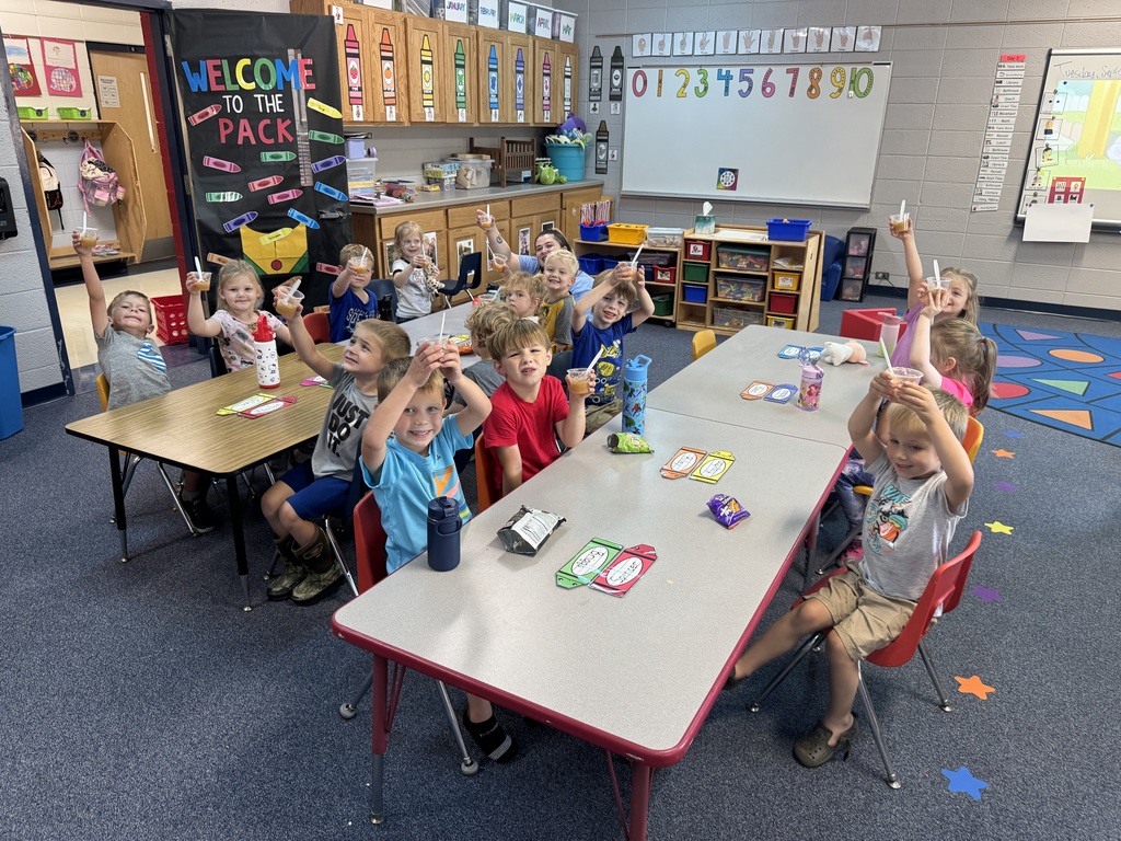 Students showing off their applesauce