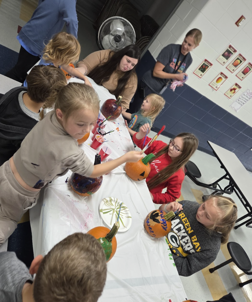 4K & 4th Graders Painting Pumpkins
