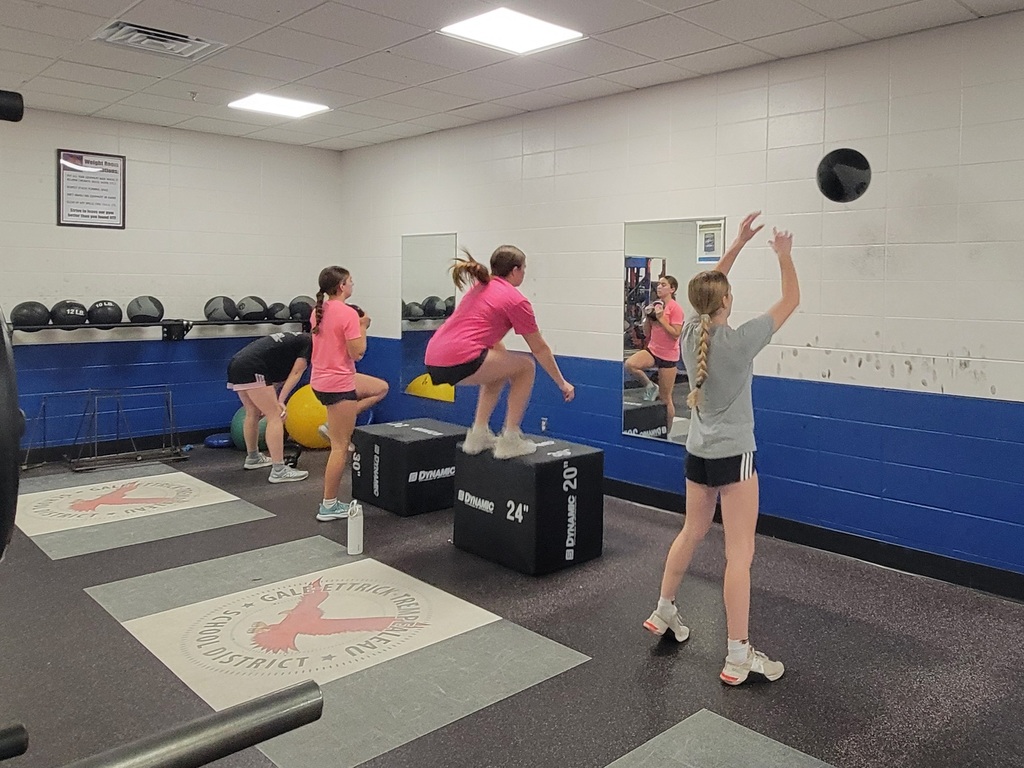 Lady Red Hawks using the weight room
