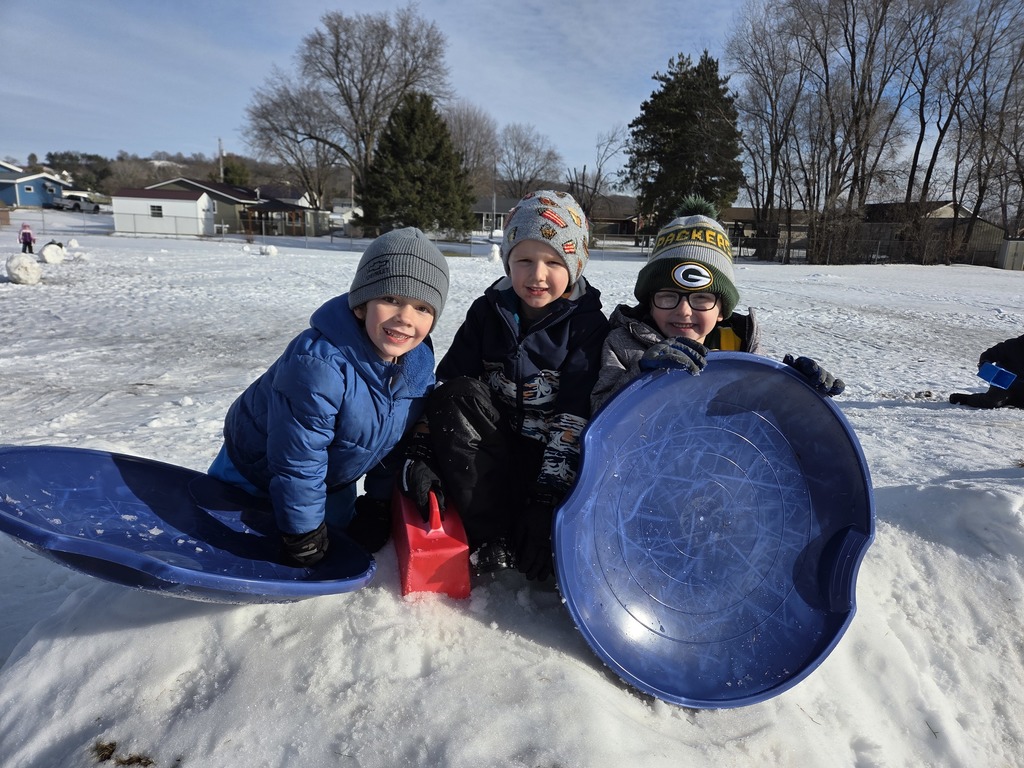 Students with sleds