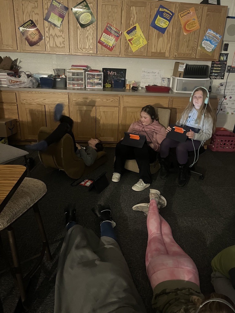 Students listening to podcasts with snacks, drinks, and blankets