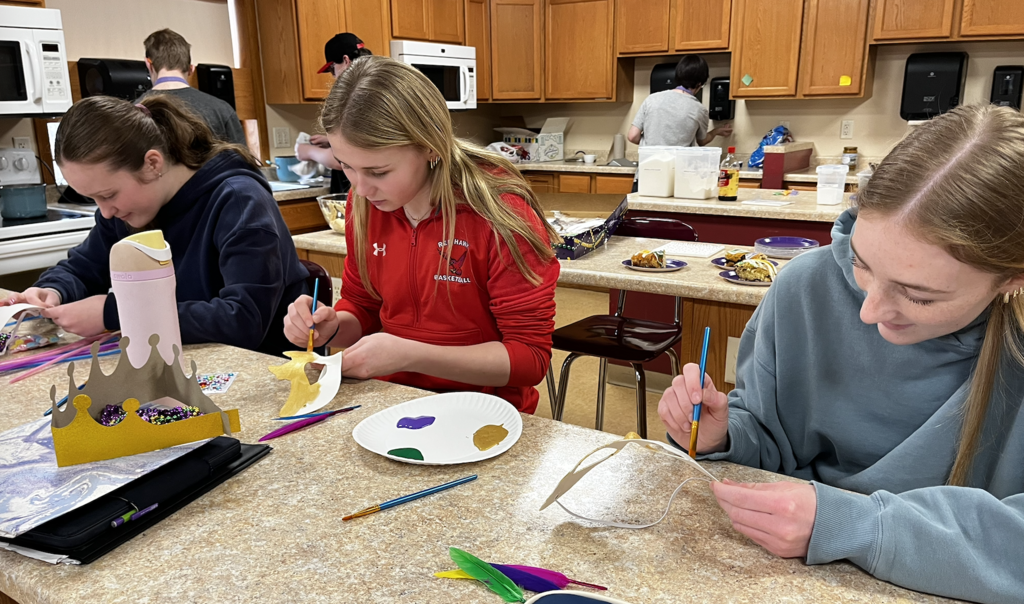 Students decorating their Mari Gras Masks.