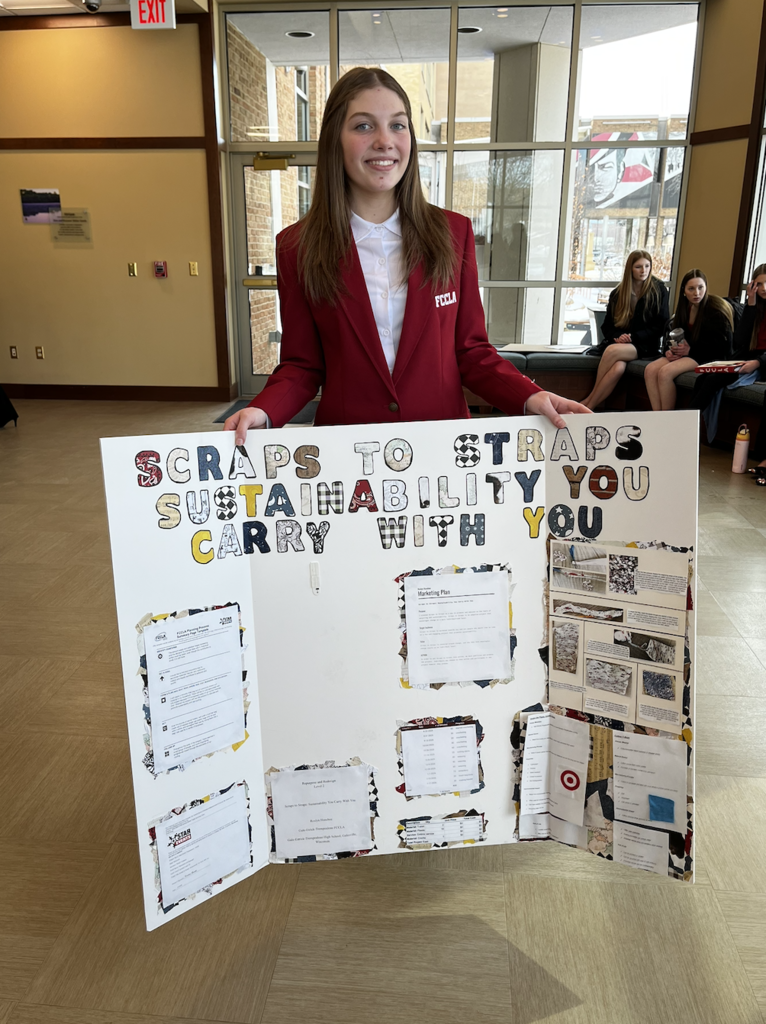 A student showing off their Repurpose and Redesign project. 