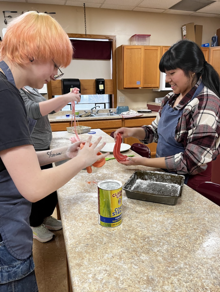 Students pull their cooled taffy.