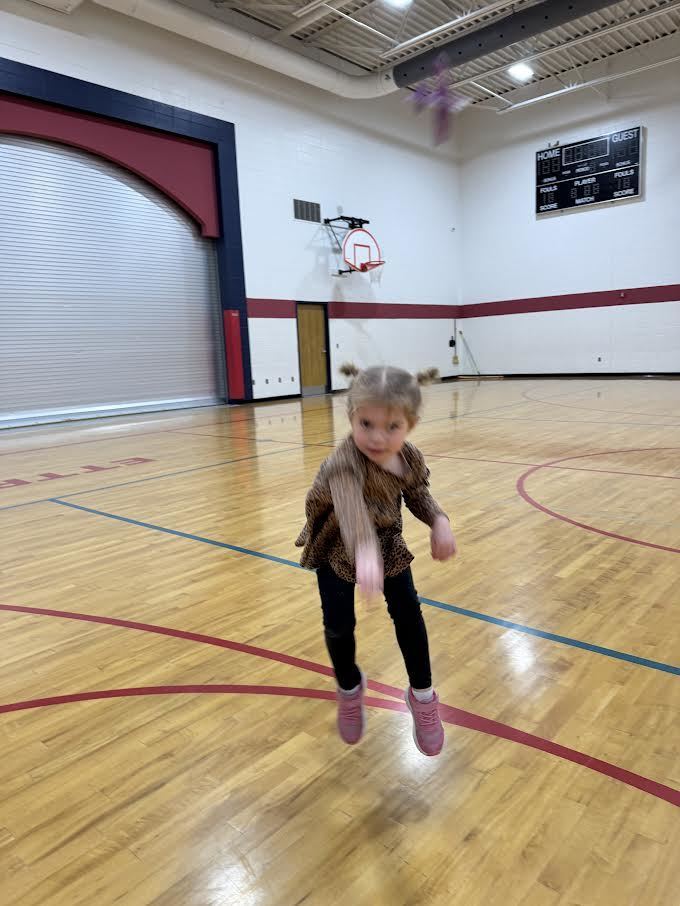 Students participating in a throwing airplane contest
