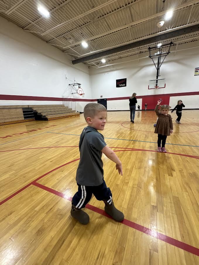Students participating in a throwing airplane contest