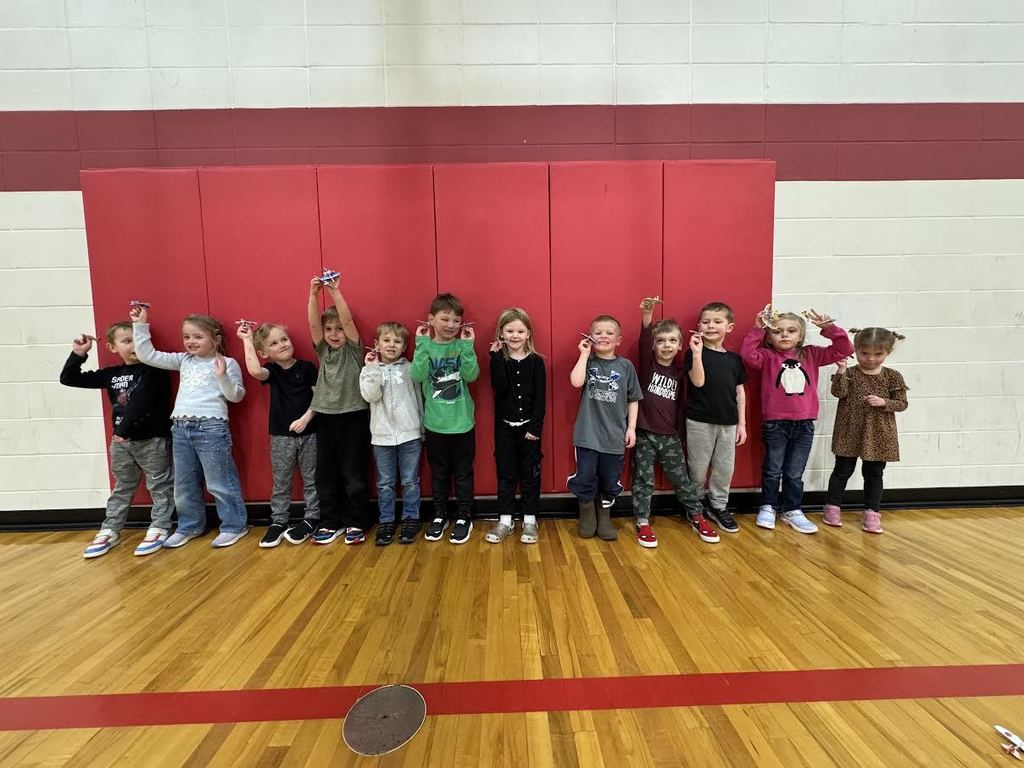 Students participating in a throwing airplane contest
