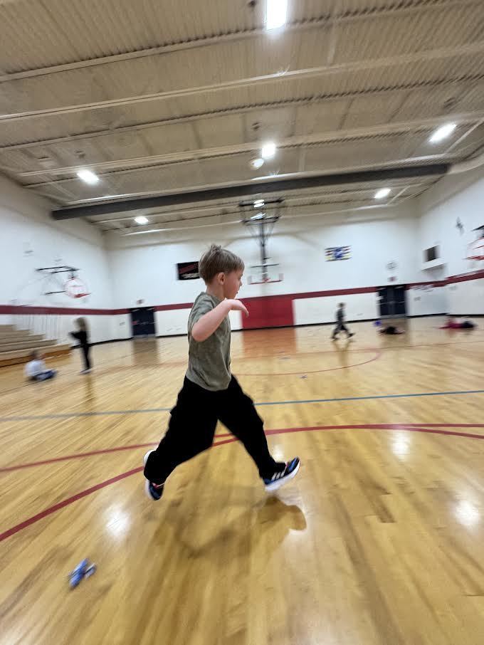 Students participating in a throwing airplane contest