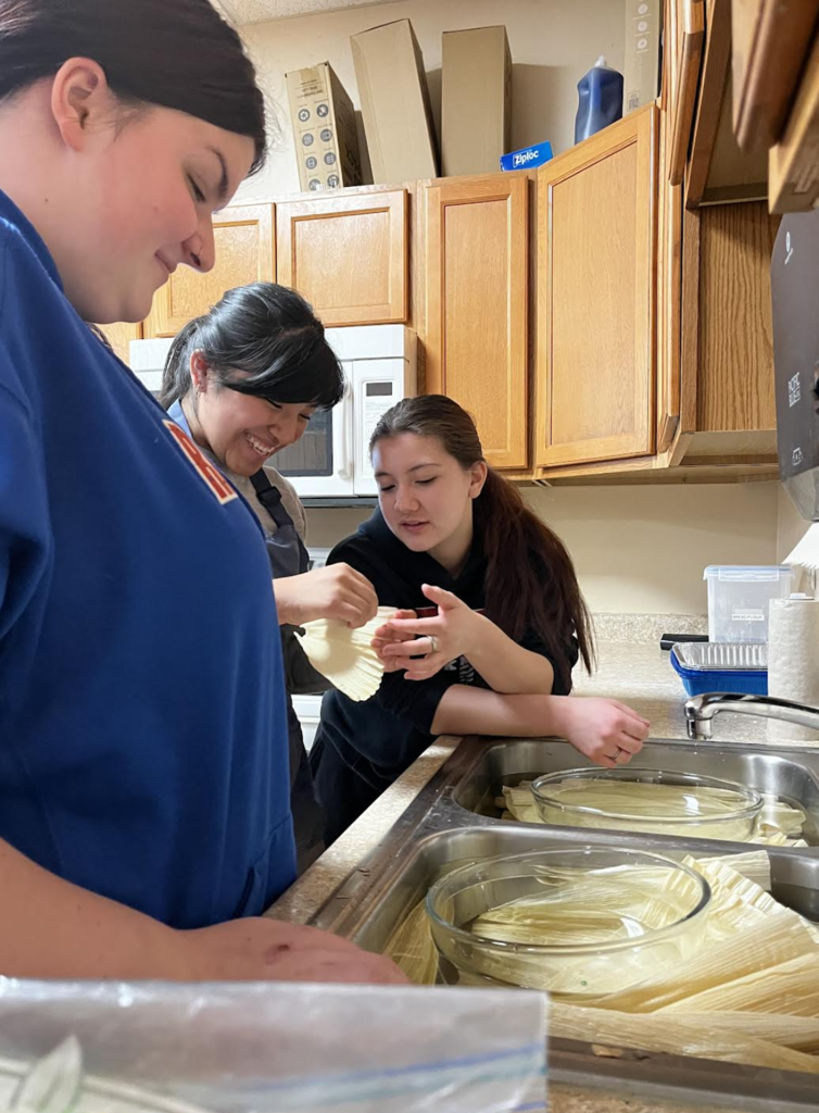 Students finding the perfect corn husks to fill.