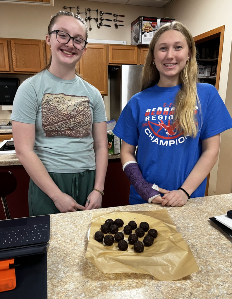 Students showing off their healthy brownie bites.