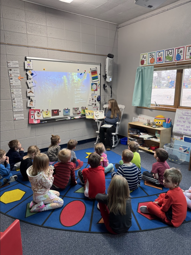 Raylin reading to students