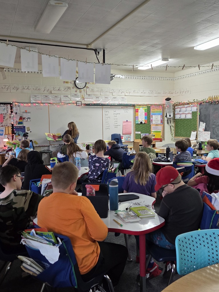 Raylin reading to students
