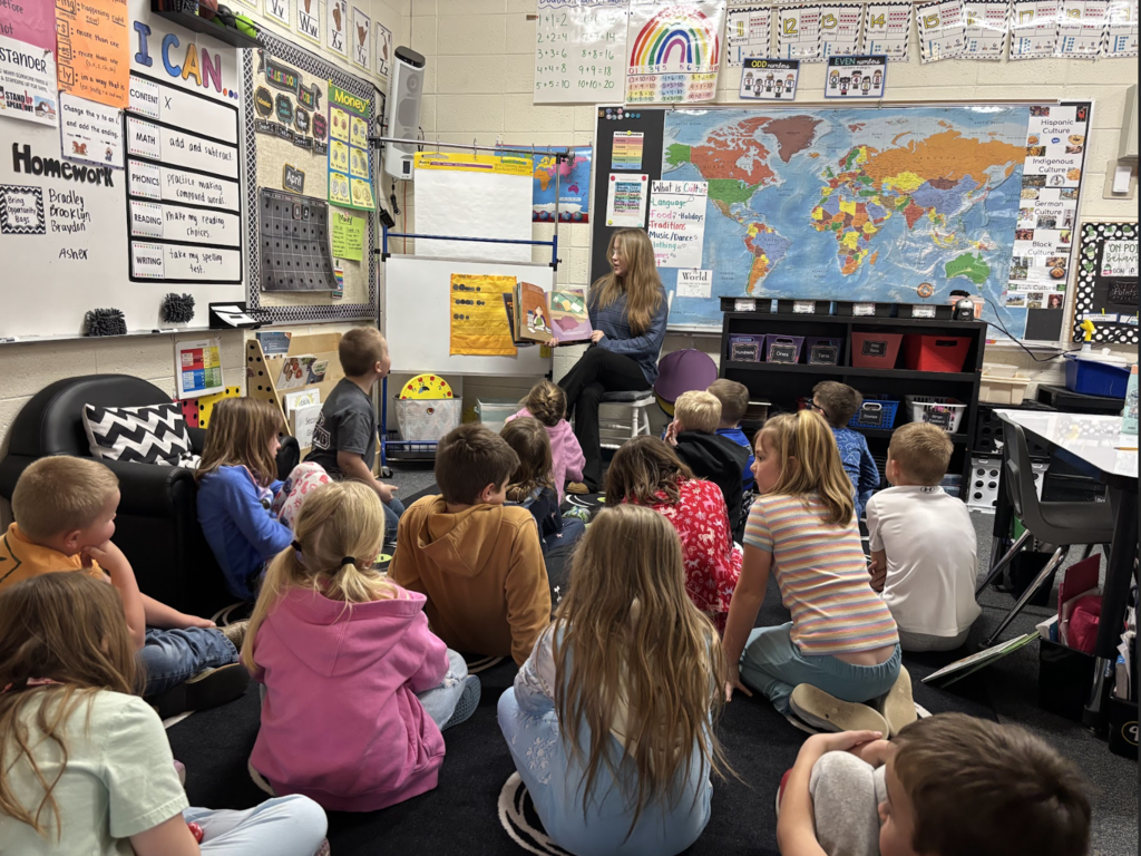 Raylin reading to students