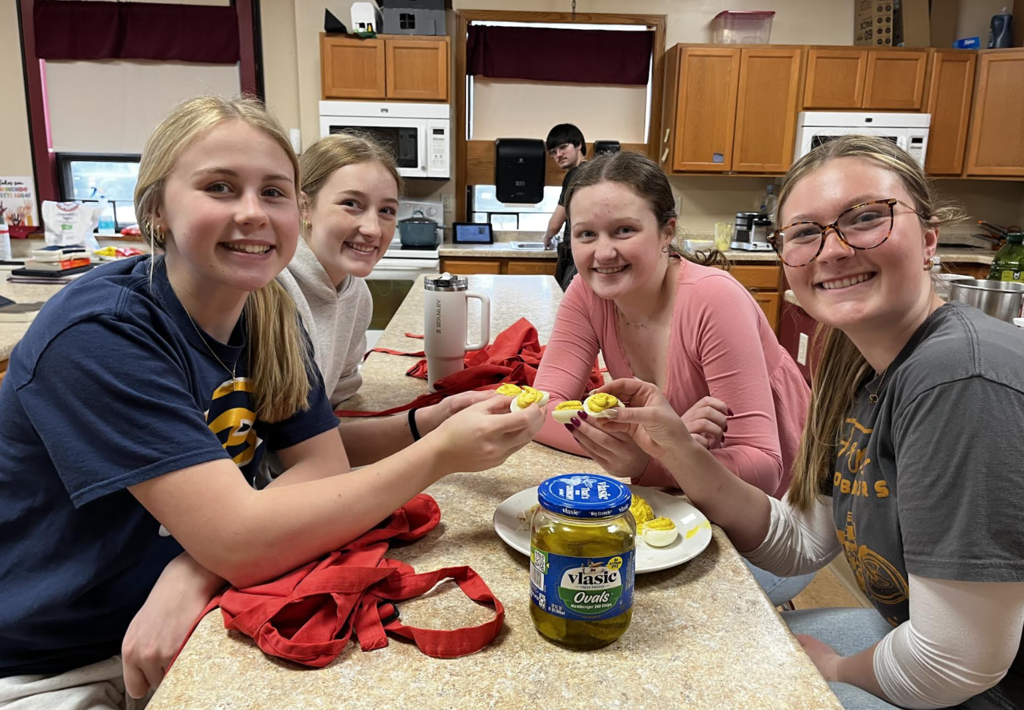 A group of students showing off their final deviled eggs!