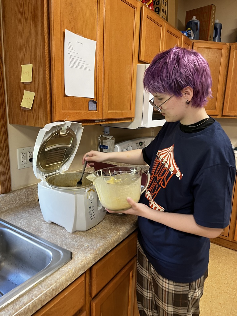 A student preparing deep fried Oreos.
