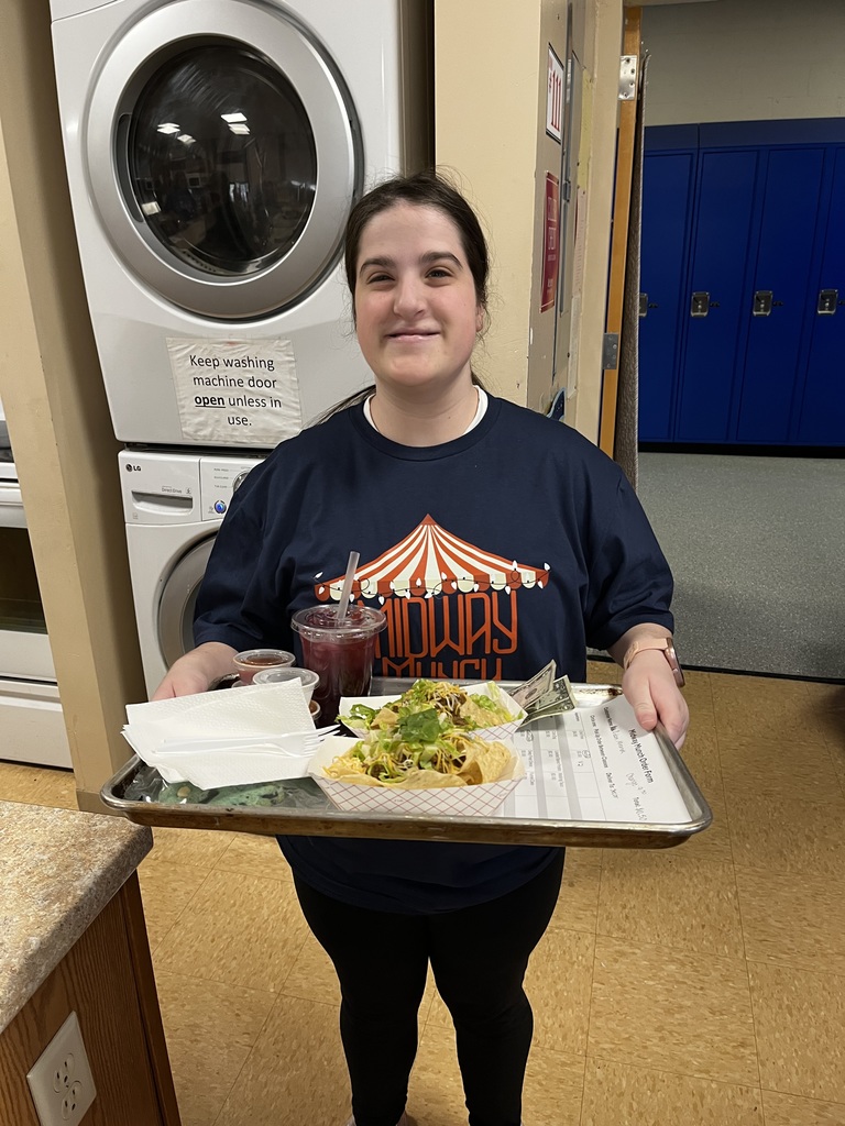 A student ready to deliver an order with a big smile!