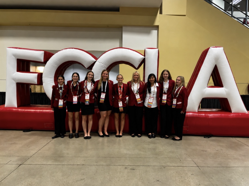 Students pose in front of the giant FCCLA sign.