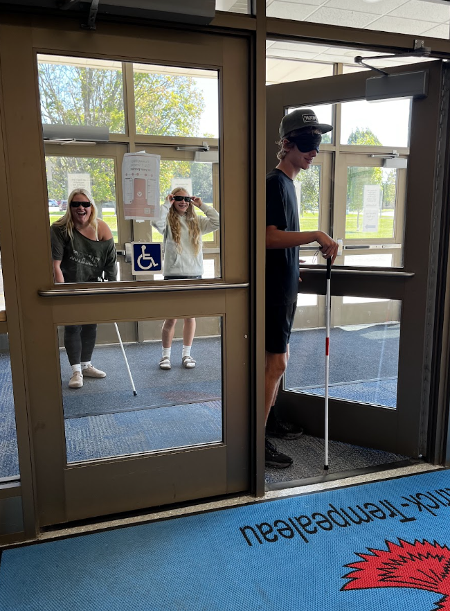 Students use a mobility cane to help them navigate the halls. 