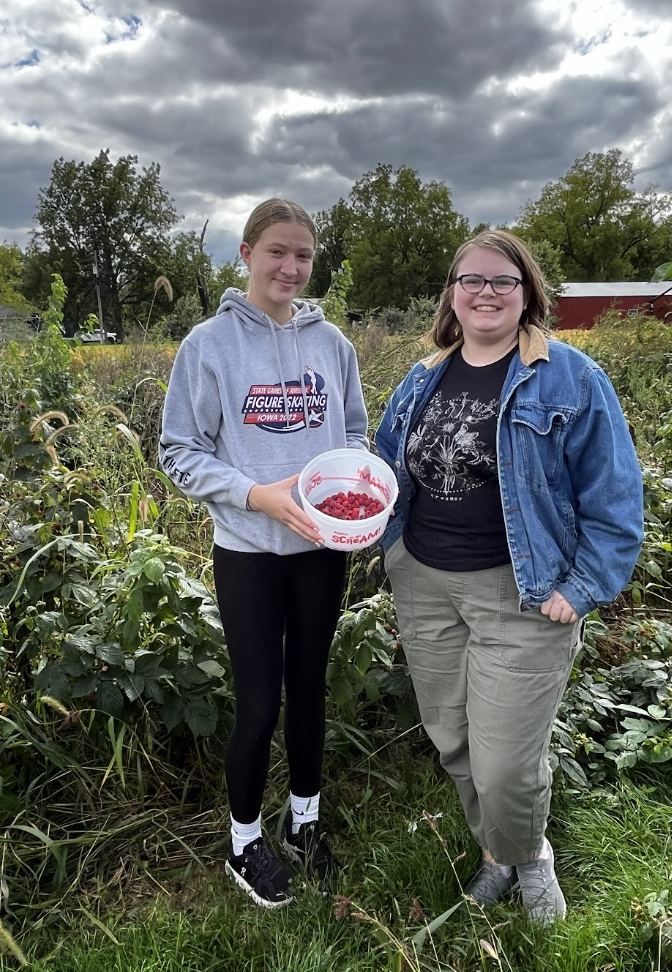 Students showing off their raspberry haul!