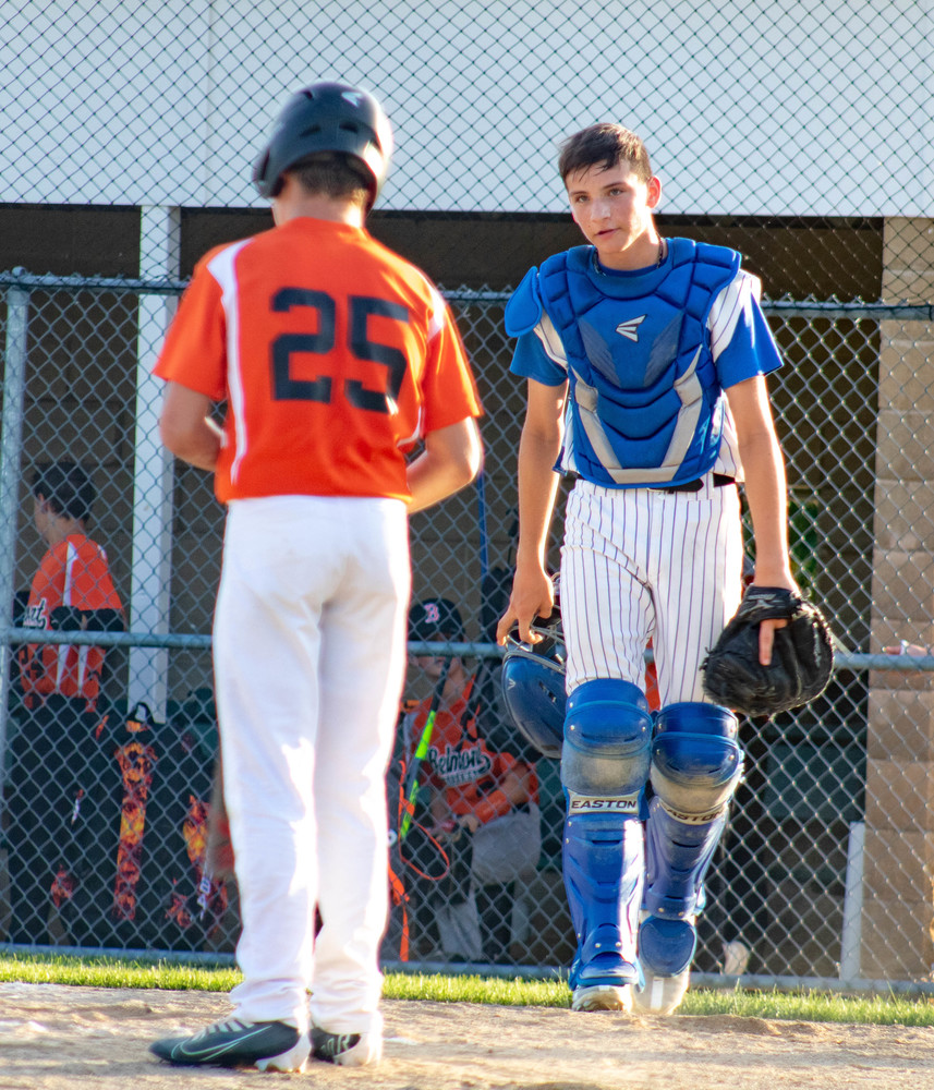 Freshman Mason Smith ‘26 stares down his opponent after an intense inning.“ I love catching because it provides a challenge that is super unique and interesting. I still love to hit home-runs a lot more, though.” Smith is excited to play more competition this year, where he hopes he can be a big contribution to the Pirates.