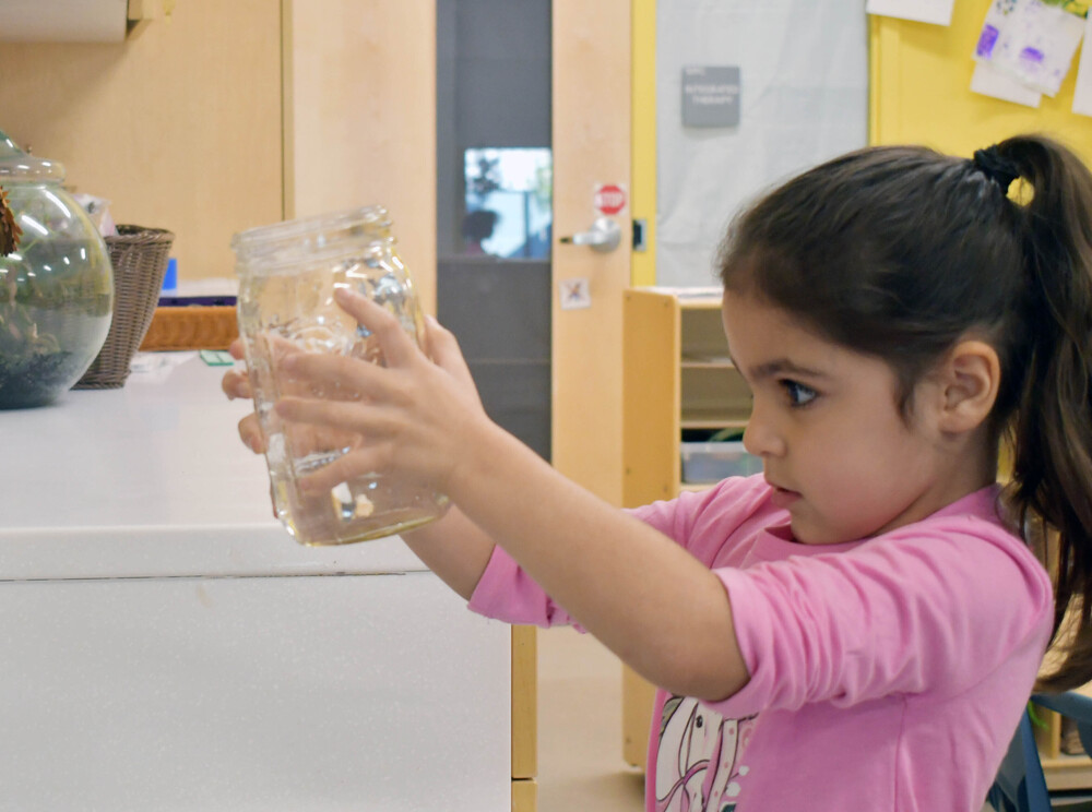 Bright Futures Student holding Mason Jar 