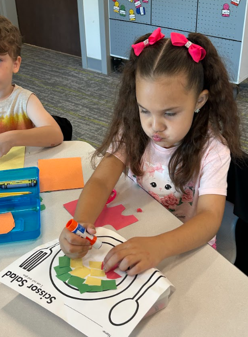 Kindergarteners making "scissor salad"