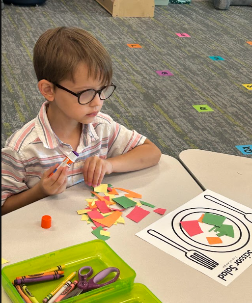 Kindergarteners making "scissor salad"