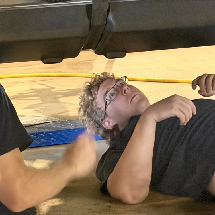 students working on the kit car
