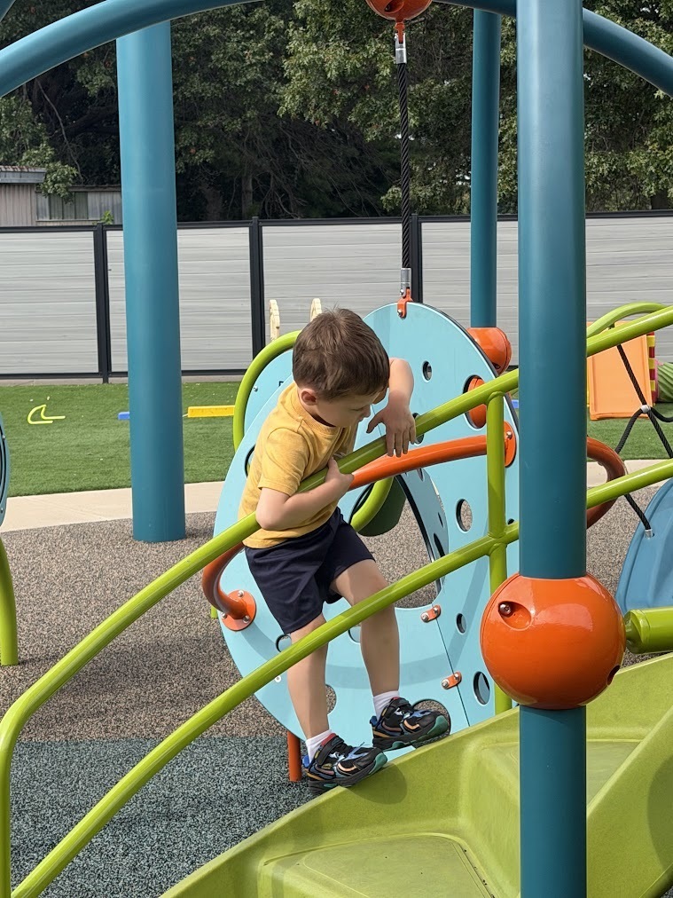 student climbing on playground 