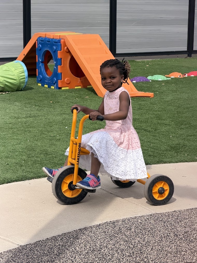 student on tricycle 