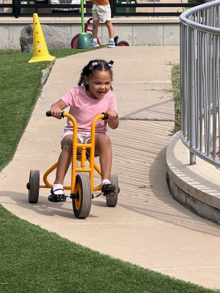 student on tricycle 