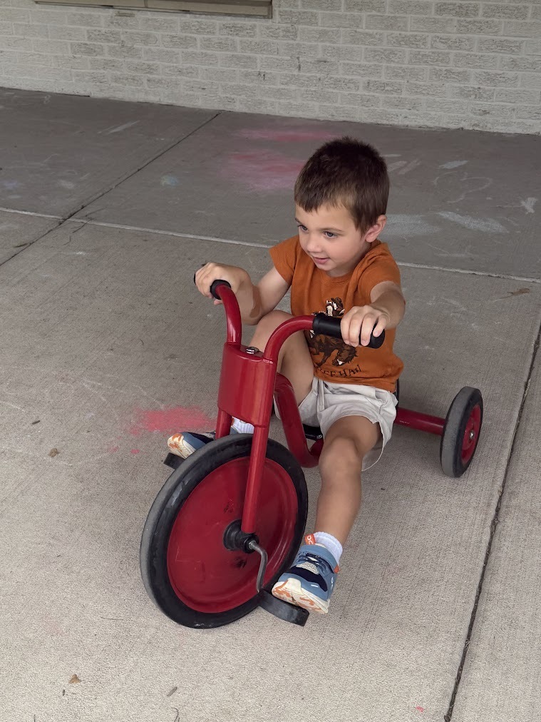 student on tricycle 