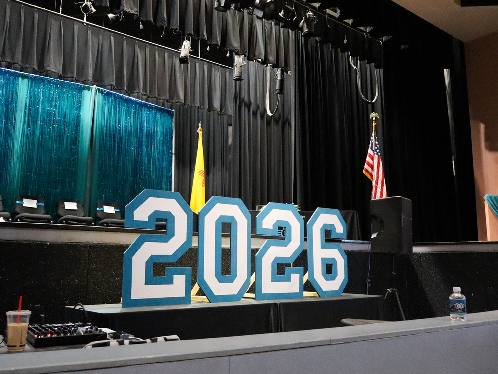 Cut out numbers of 2-0-2-6 are set upon gallup high schools auditorium stage for the OCC graduation ceremony