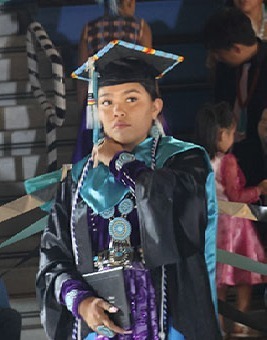 native dressed graduate