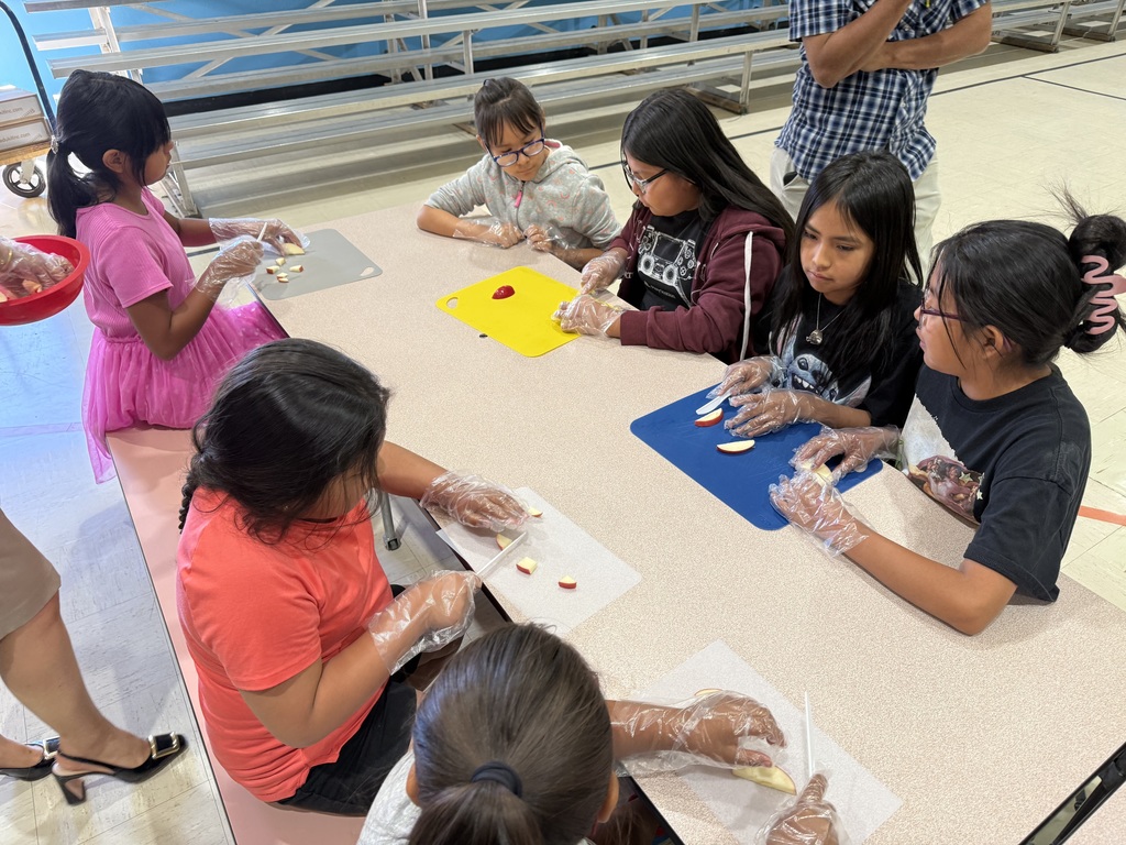 2nd and 4th graders working together in the I CAN program.